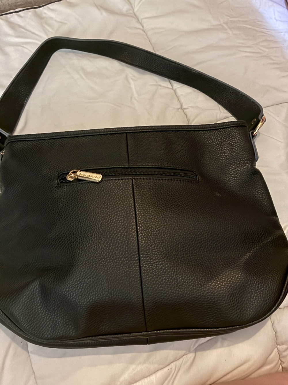 Black pebble vegan leather Montana west shoulder purse.